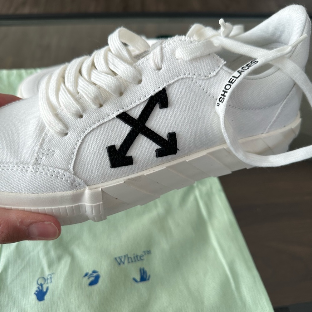 Brand new never worn off white shoes . Reason of selling is size